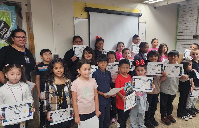  Students holding certificates