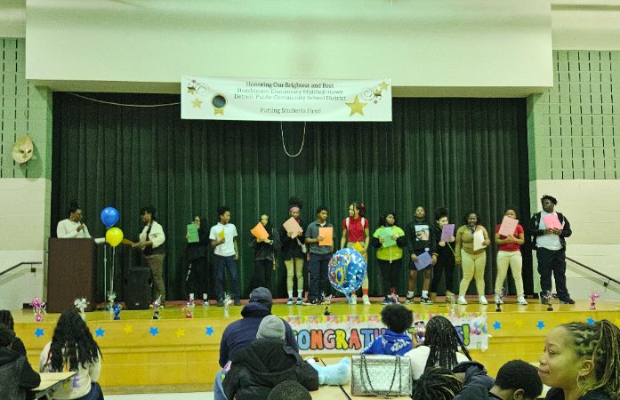  picture of students receiving their honors awards.