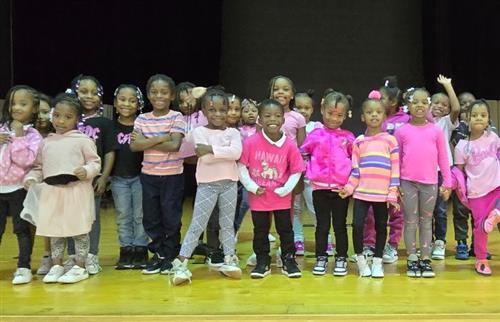 kindergartners on stage wearing pink