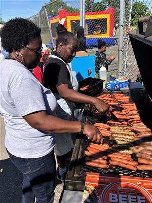 Two of Clark's lovely grillers preparing the food 