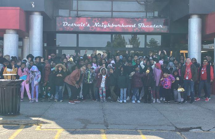  Clark Prep students and staff pose outside Detroit’s Neighborhood Theater after a fun school-wide m