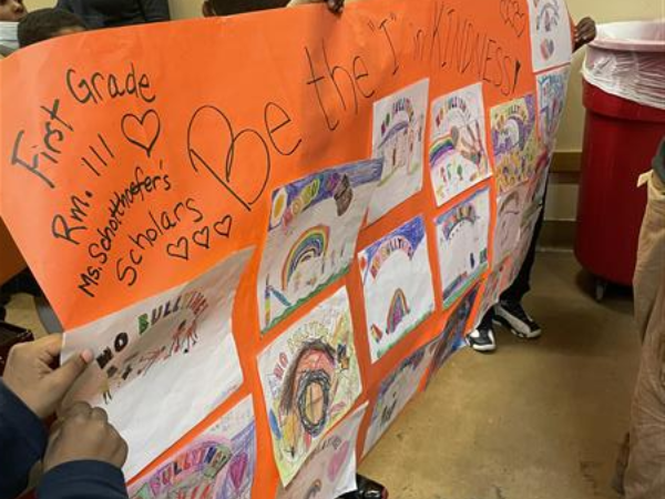 students hold an anti-bullying banner