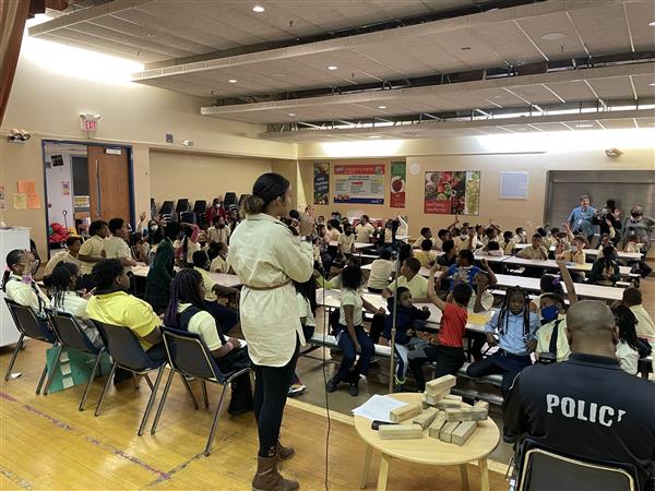 A teacher speaks to students about bullying