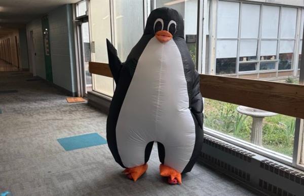 Student in penguin costume