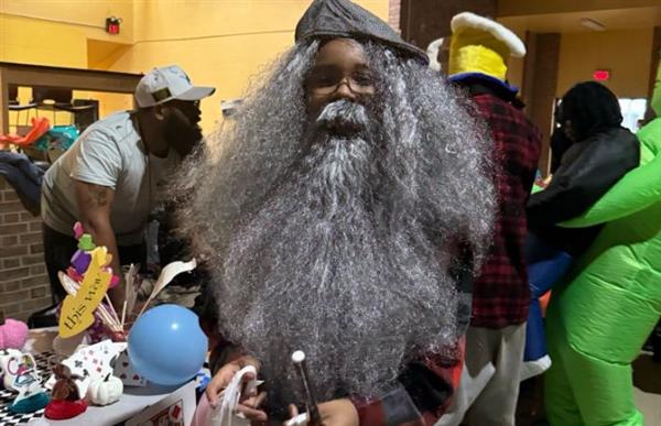 student in old gray beard costume