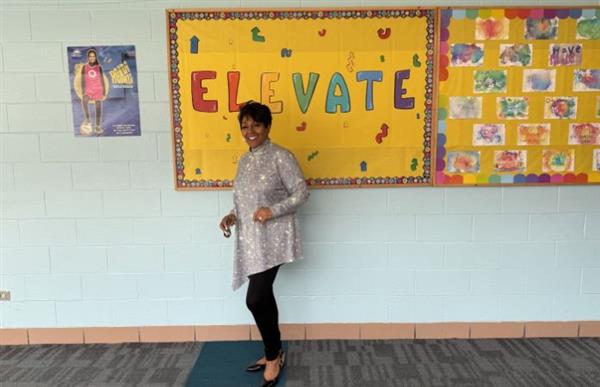 woman standing in front of a bulletin board
