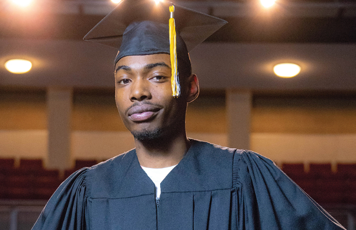  Young man with graduation cap on